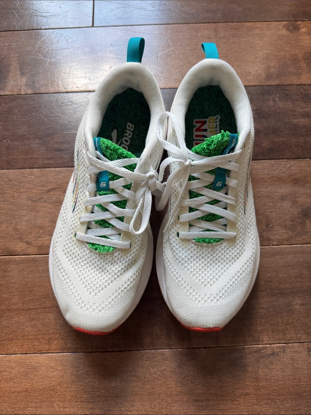 Brooks Revel White Sneakers with Green and Teal Accents